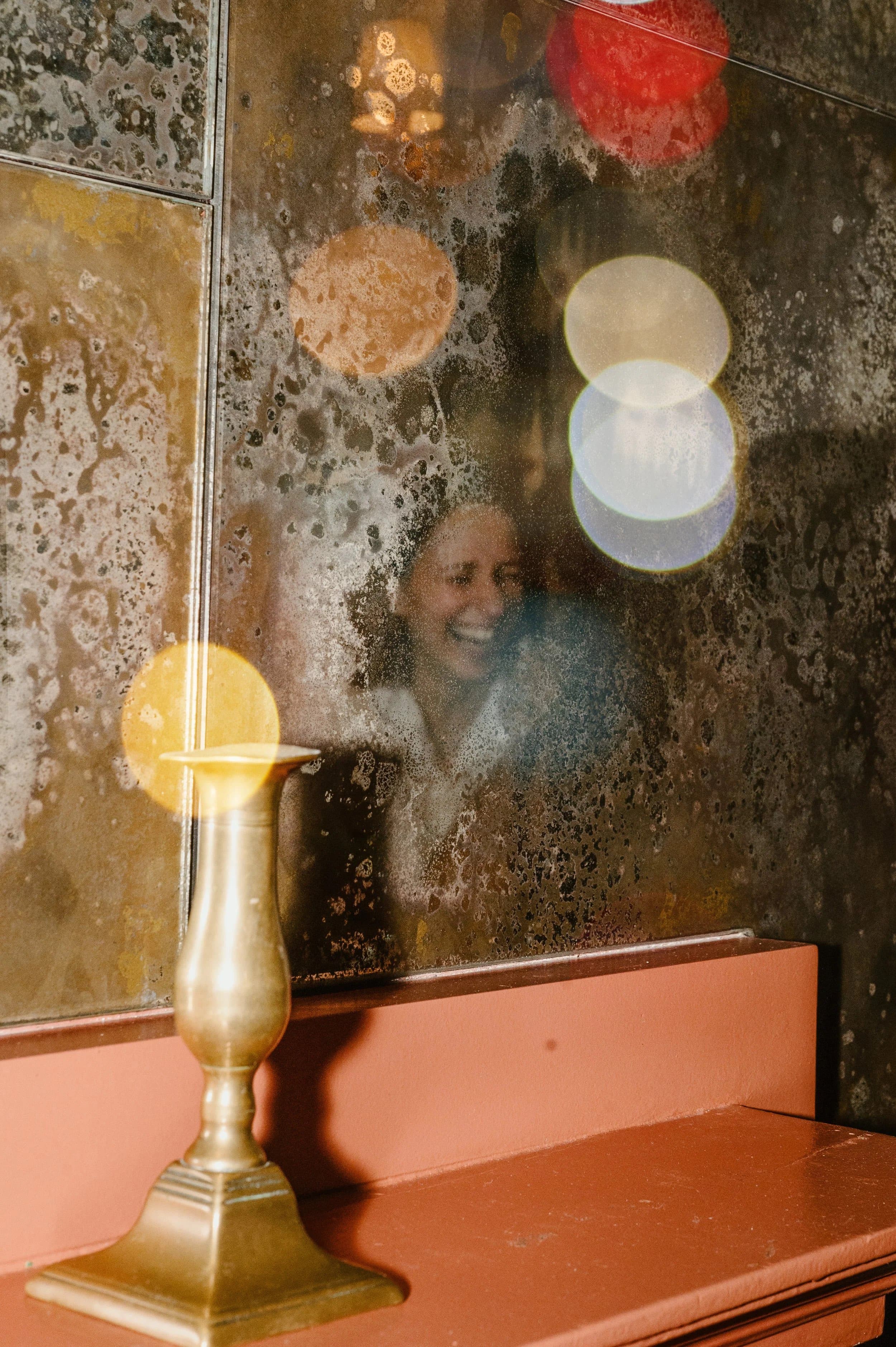 Candlelight reflected in an antique mirror — event detail at Home House