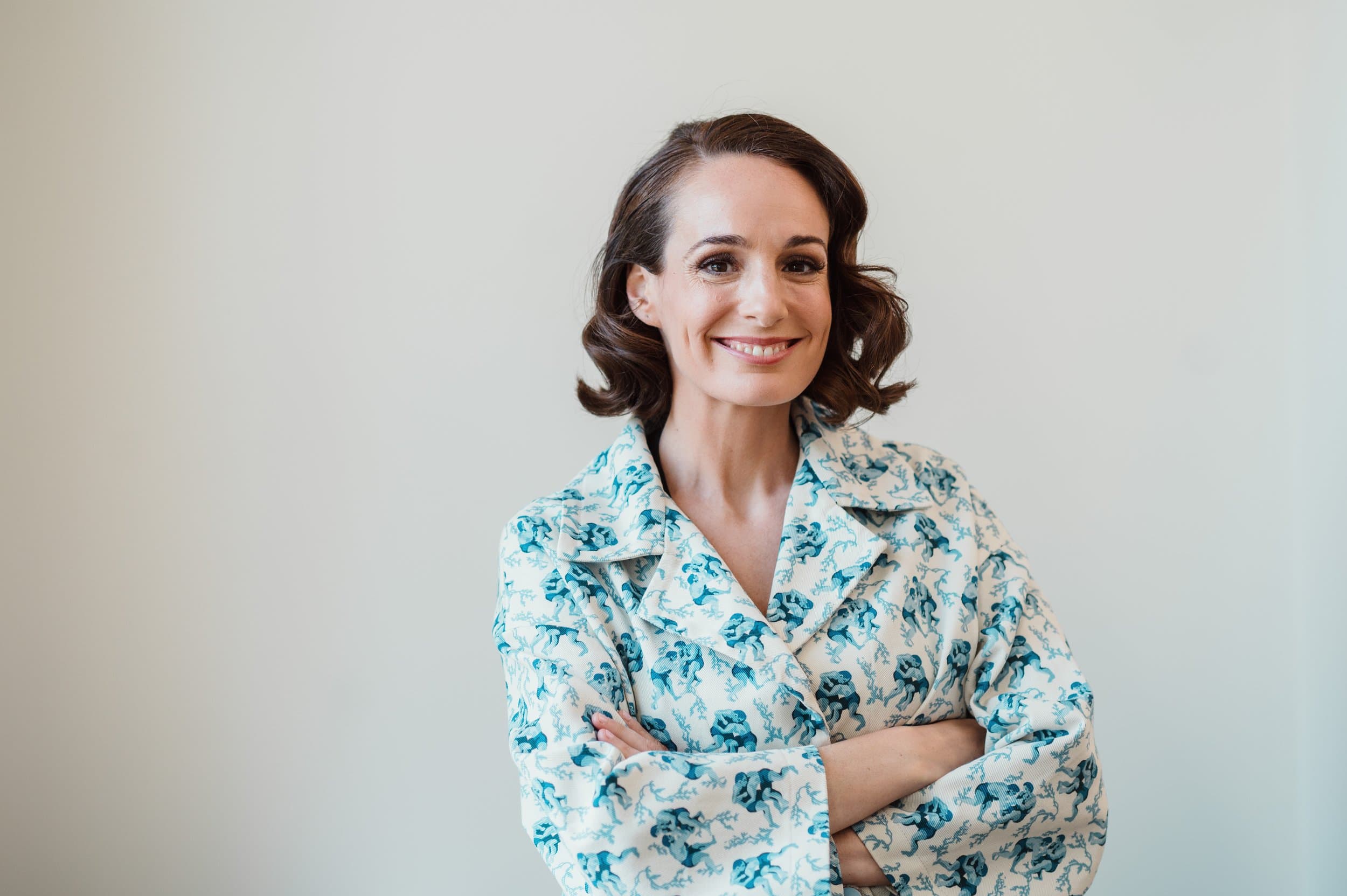 Professional headshot of a smiling woman by Razia Jukes